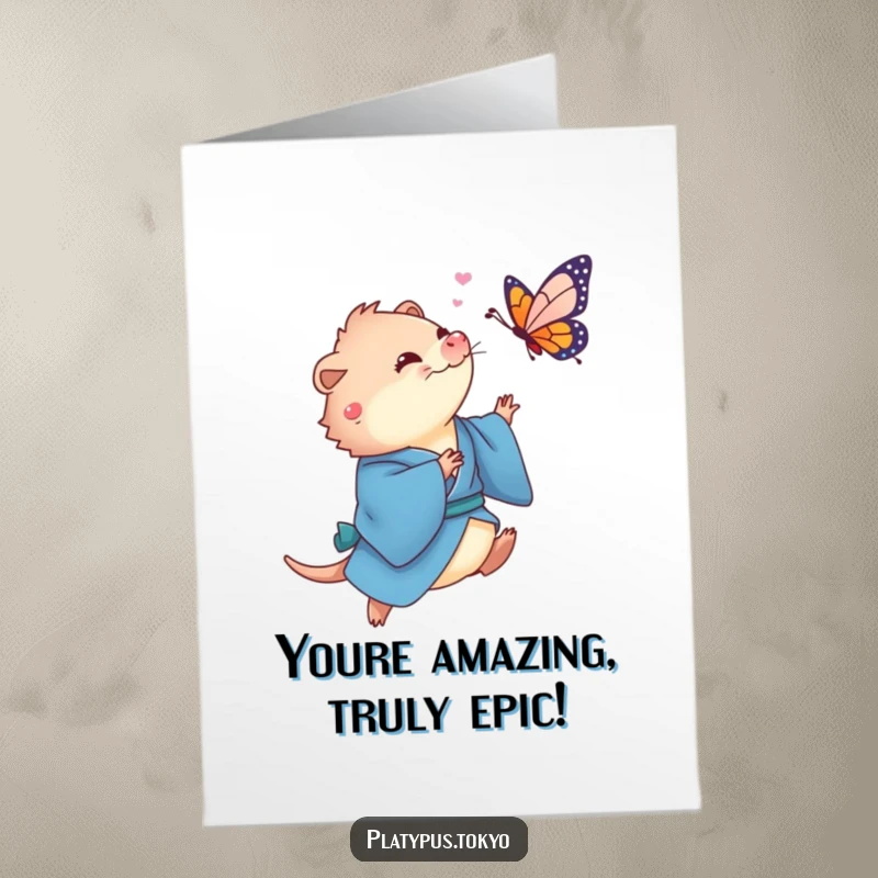 Funny Free Printable Congratulations Card: a platypus in a blue kimono joyfully chases a vibrant butterfly.