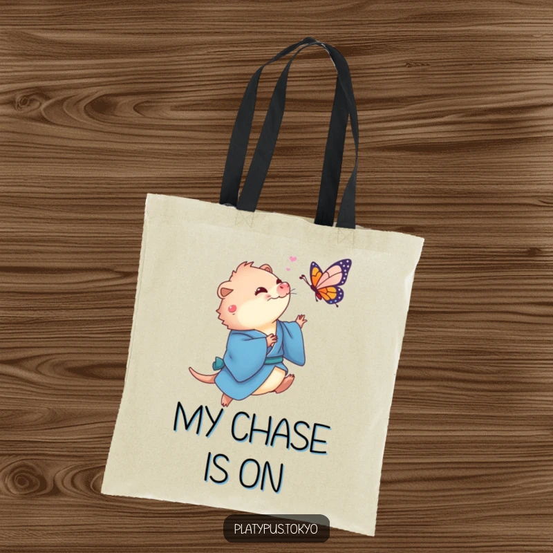 Funny Platypus Butterfly Tote Bag showing a cute platypus in a flowing blue kimono playfully chasing a colorful butterfly.